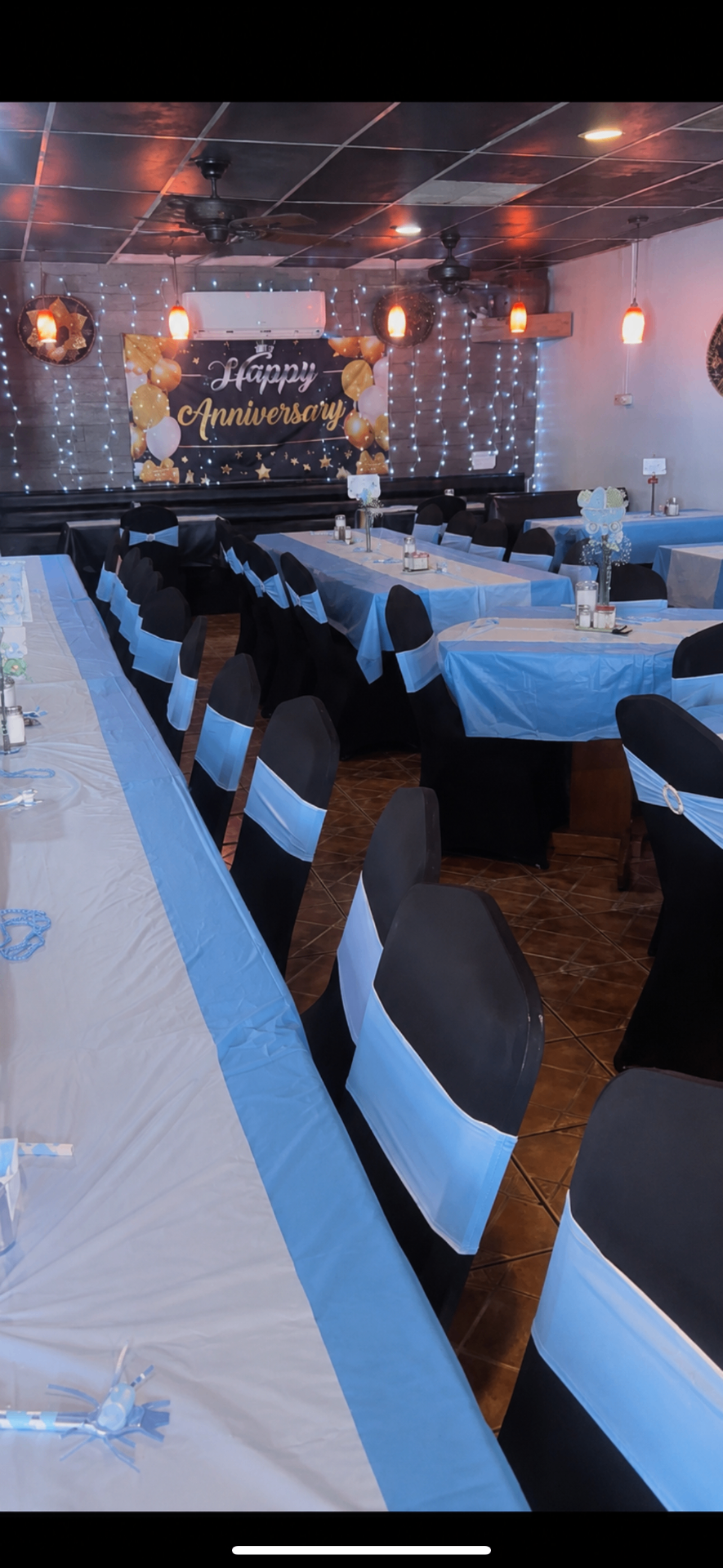 Venue decorated with blue and white linens for a special celebration