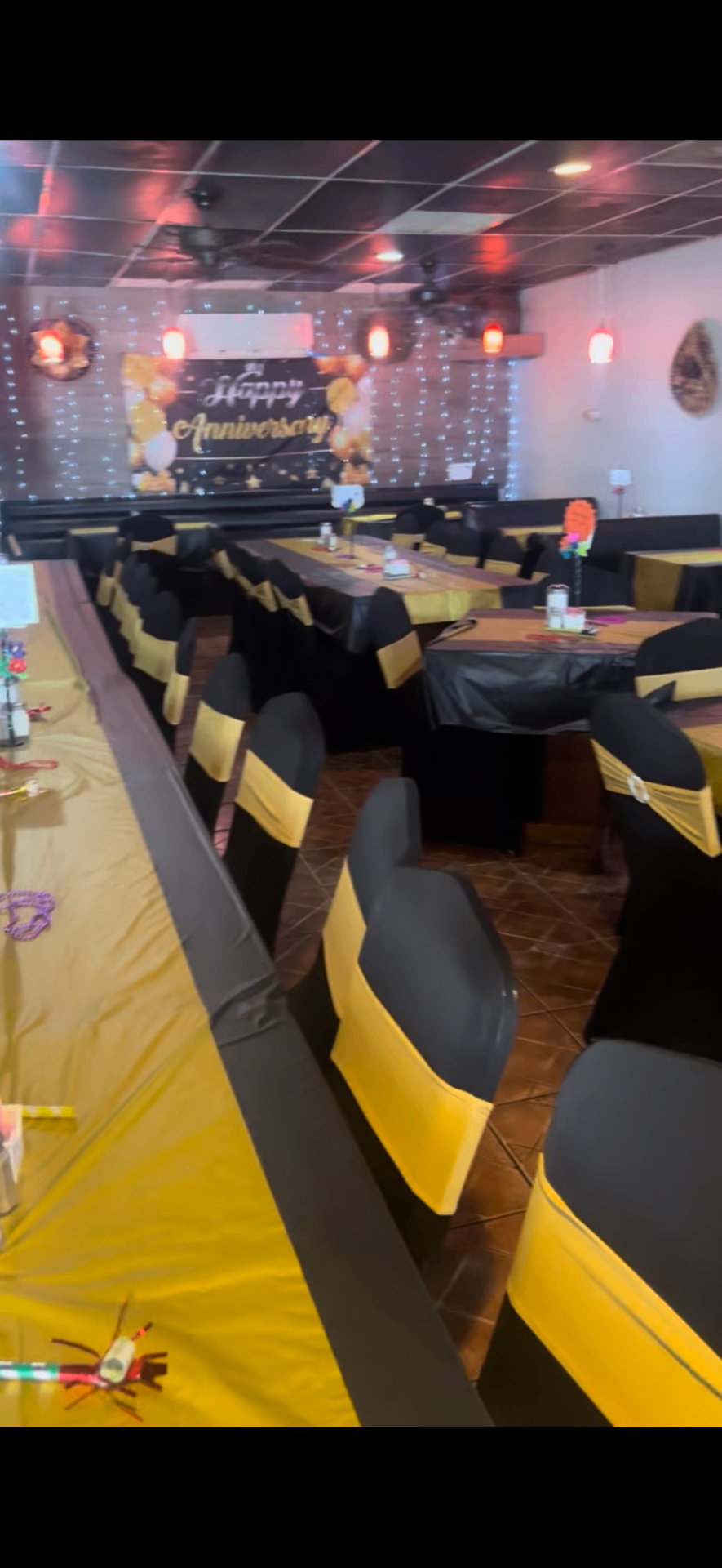 Our San Antonio venue set up with black and gold decor for a celebration